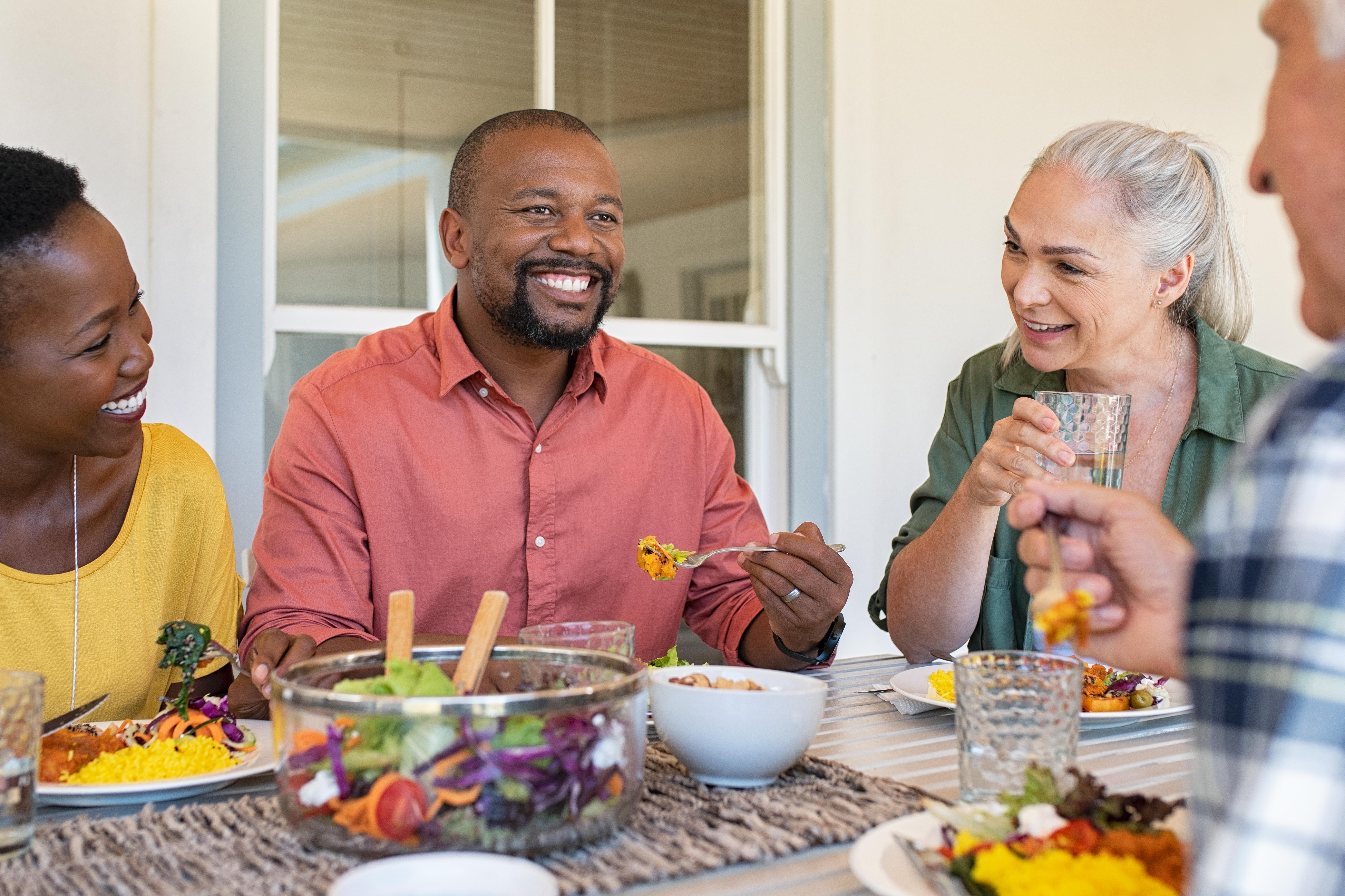 Family and friends sharing a meal around a table