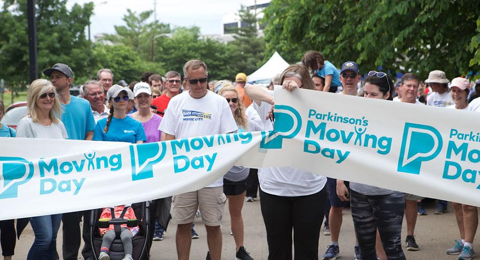 People celebrating at the Moving Day starting line