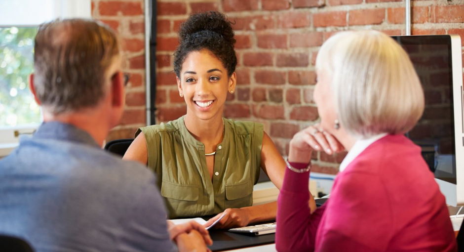 Couple talking to a woman professional